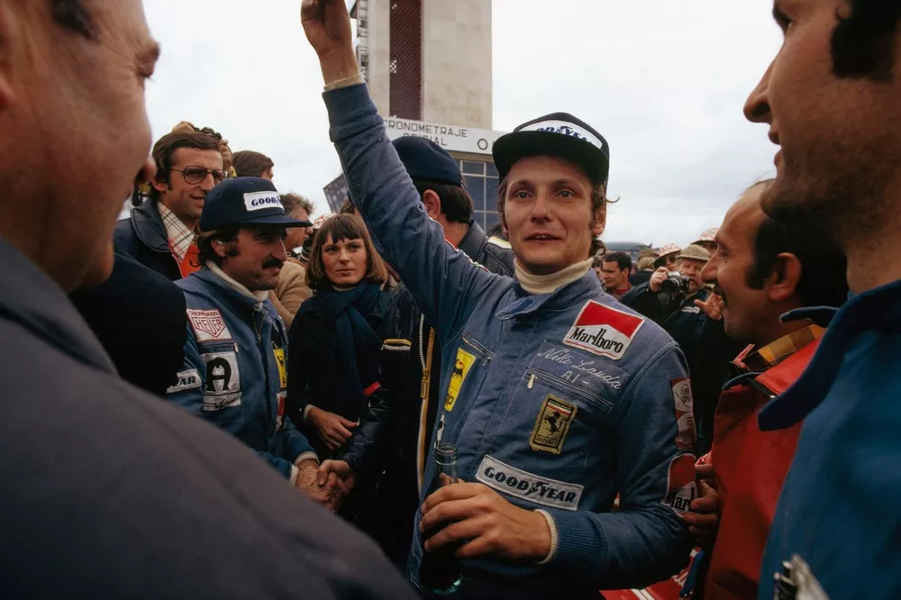 Niki Lauda y Clay Regazzoni, Ferrari celebran