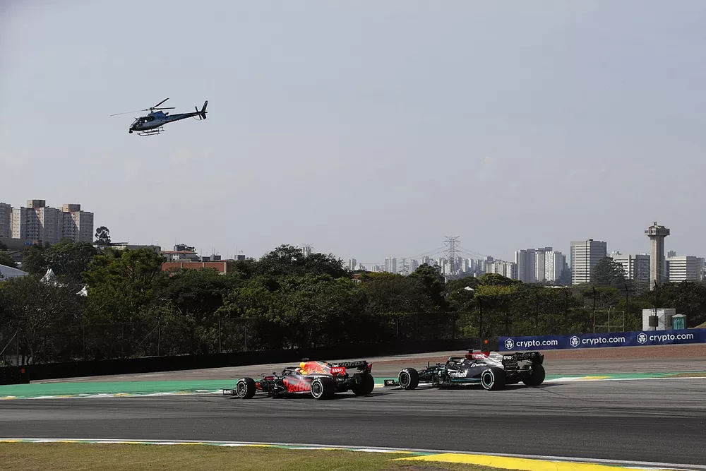 Max Verstappen, Red Bull Racing RB16B, battles with Lewis Hamilton, Mercedes W12