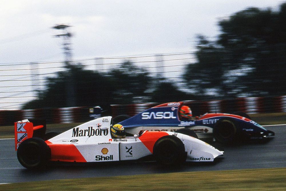 Ayrton Senna, McLaren Ford MP4/8 passes Eddie Irvine, Jordan Hart J193