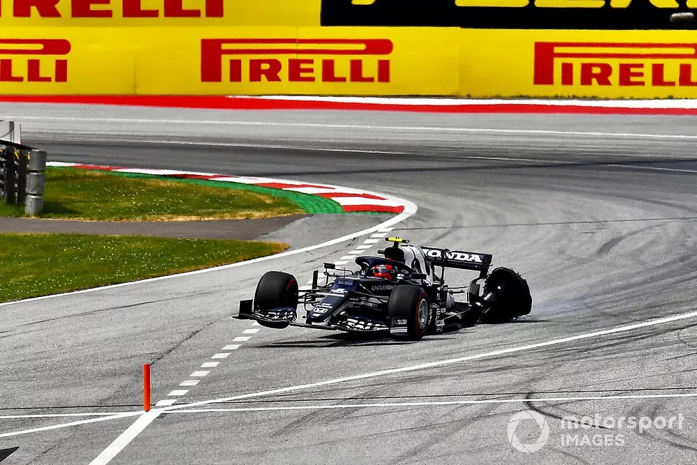 Pierre Gasly, AlphaTauri AT02, limps back to the pits and into retirement with a puncture and damage on the opening lap