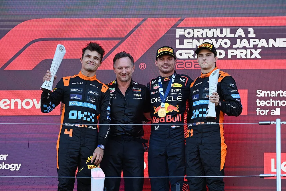 Lando Norris, McLaren, 2nd position, Christian Horner, Team Principal, Red Bull Racing, Max Verstappen, Red Bull Racing, 1st position, Oscar Piastri, McLaren, 3rd position, on the podium