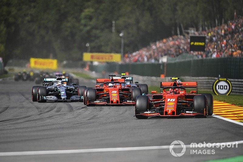 Charles Leclerc, Ferrari SF90, leads Sebastian Vettel, Ferrari SF90, Lewis Hamilton, Mercedes AMG F1 W10, Valtteri Bottas, Mercedes AMG W10, and the rest of the field on the opening lap