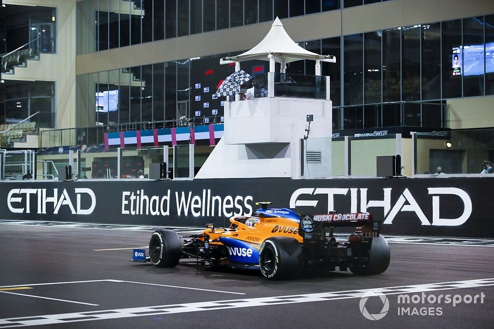 Lando Norris, McLaren MCL35, crosses the line to take te checkered flag