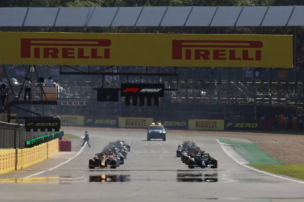 Lewis Hamilton, Mercedes W12, and Max Verstappen, Red Bull Racing RB16B, preapre to lead the field away