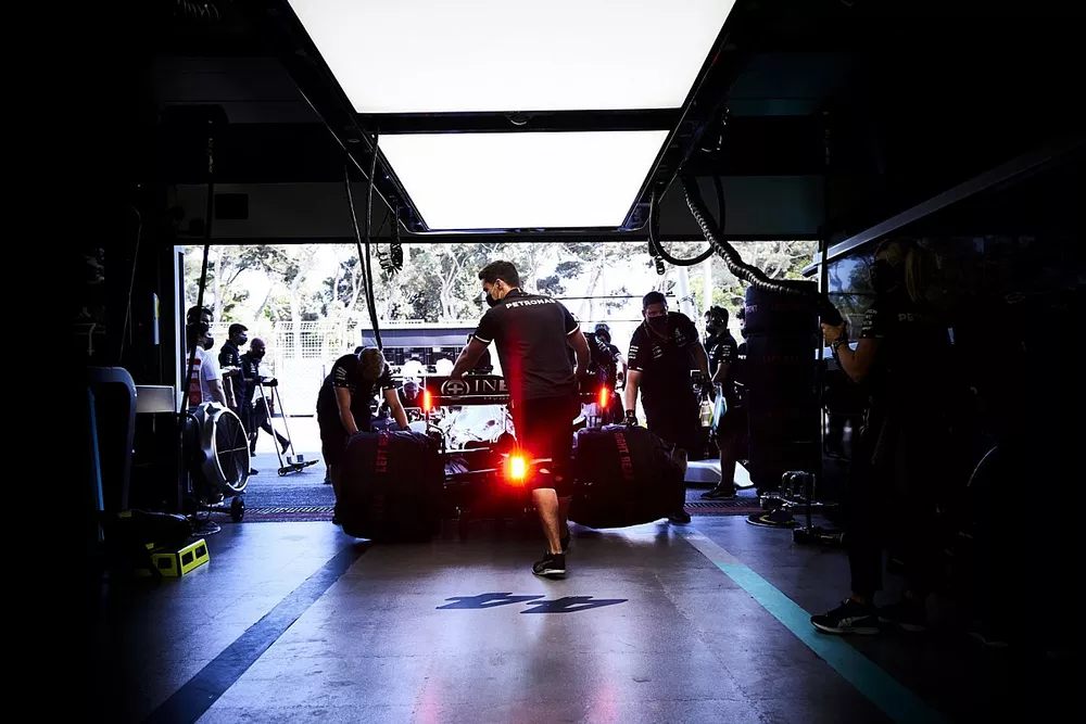 Lewis Hamilton, Mercedes W12, is returned to the garage