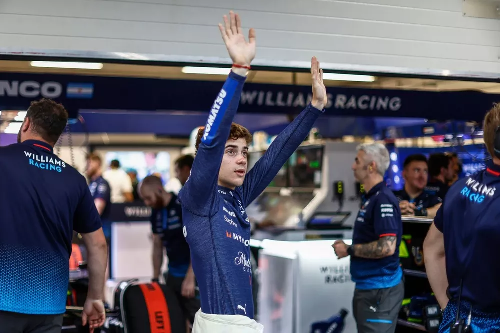 Franco Colapinto, Williams Racing, waves to fans from the pit lane