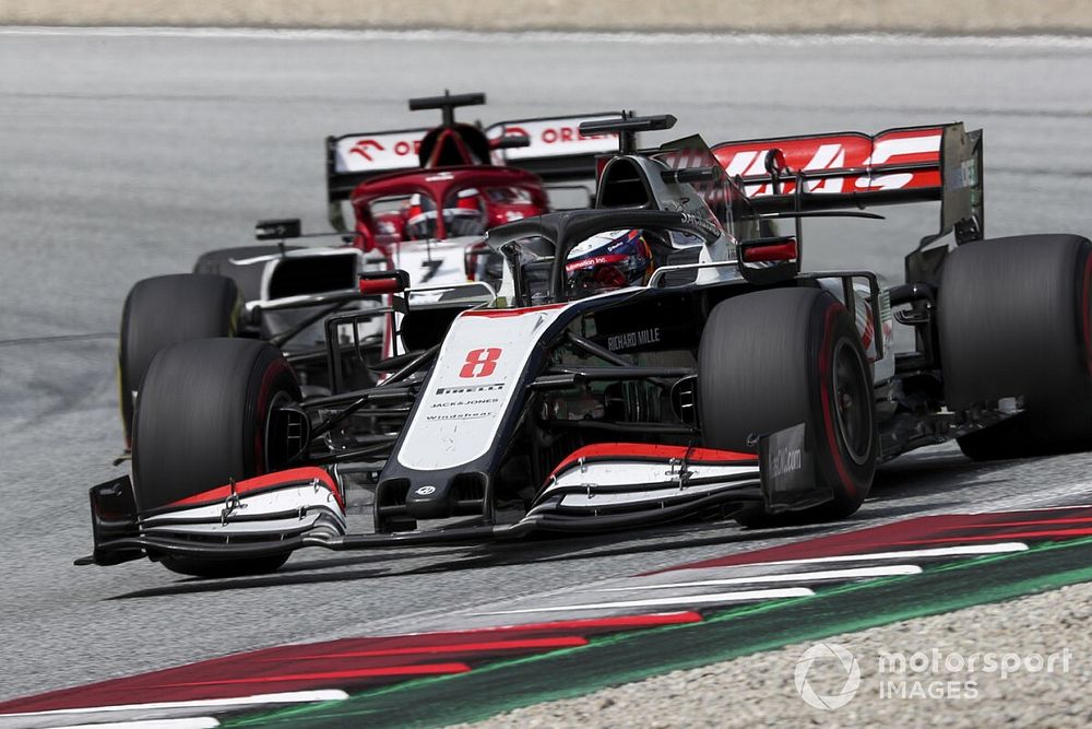 Romain Grosjean, Haas VF-20, leads Kimi Raikkonen, Alfa Romeo Racing C39
