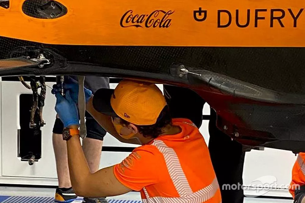 Lando Norris, McLaren is working on his car