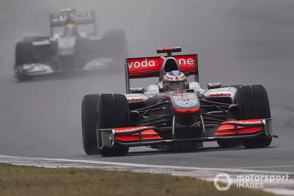 Jenson Button, McLaren MP4-25 Mercedes leads Nico Rosberg, Mercedes GP W01
