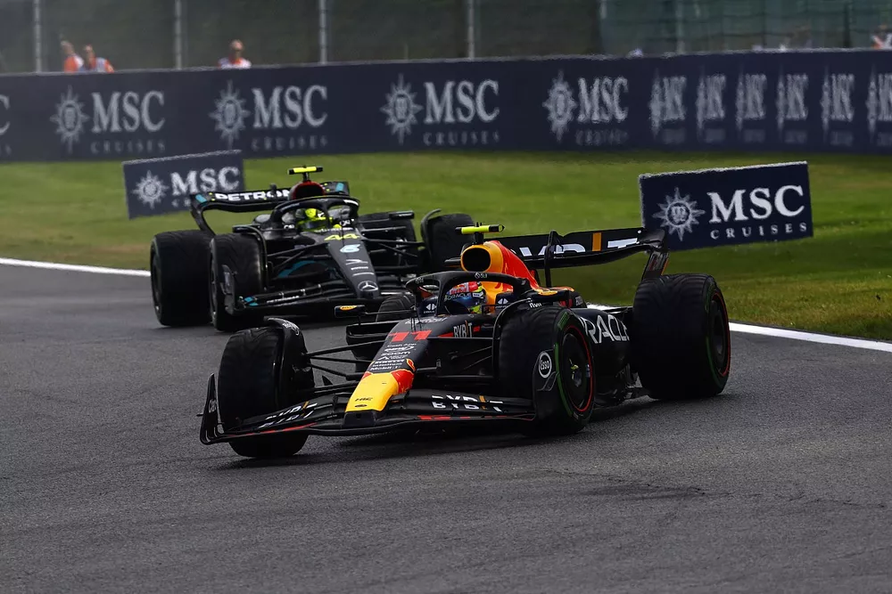 Sergio Perez, Red Bull Racing RB19, leads Lewis Hamilton, Mercedes F1 W14
