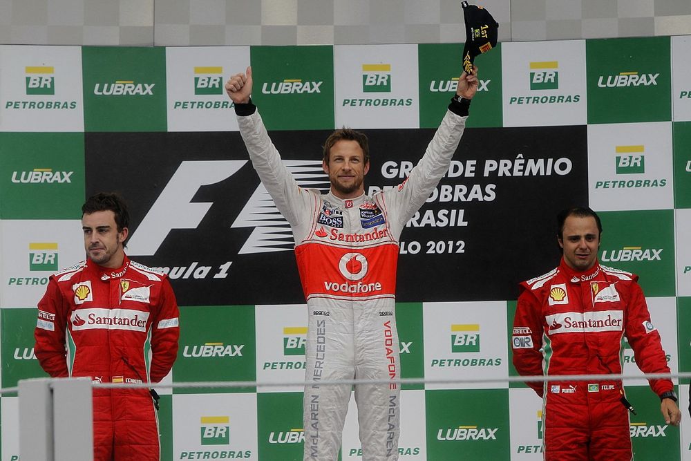 Podium: second place Fernando Alonso, Ferrari, Race winner Jenson Button, McLaren, third place Felip