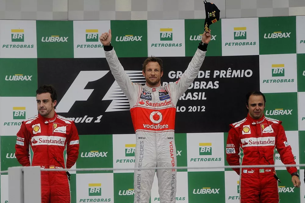 Podium: second place Fernando Alonso, Ferrari, Race winner Jenson Button, McLaren, third place Felip