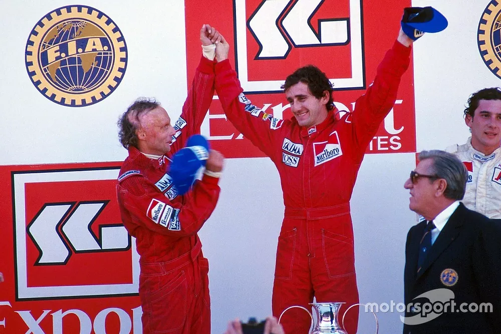 Podium: winnaar Alain Prost, tweede Niki Lauda, derde Ayrton Senna
