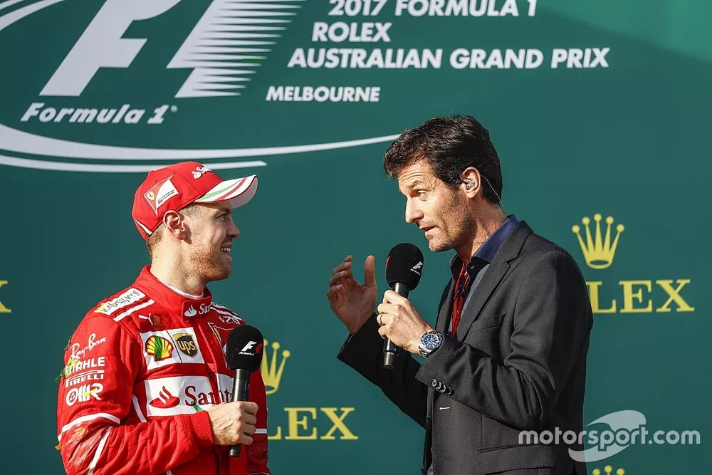 Sebastian Vettel, Ferrari, entrevistado por Mark Webber en el podium