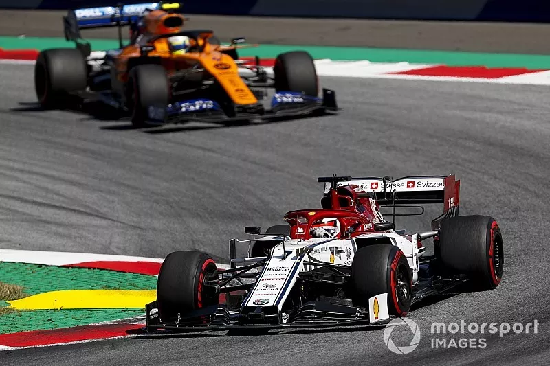 Kimi Raikkonen, Alfa Romeo Racing C38, leads Lando Norris, McLaren MCL34