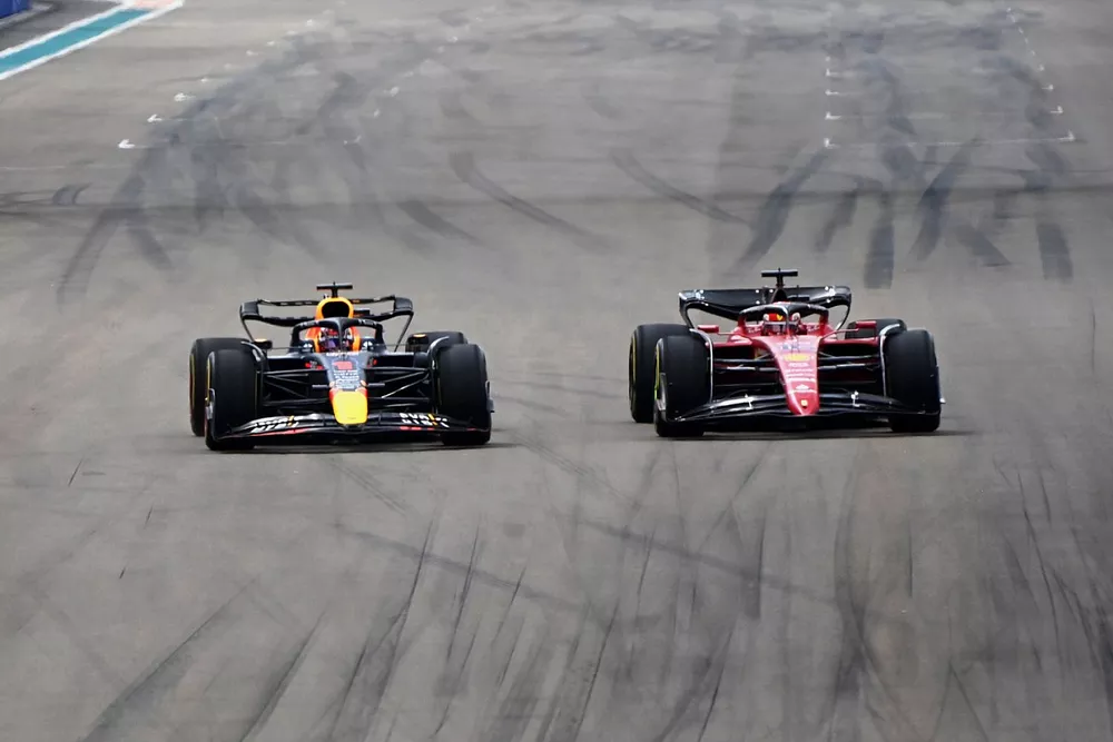 Max Verstappen, Red Bull Racing, passes Charles Leclerc, Ferrari 