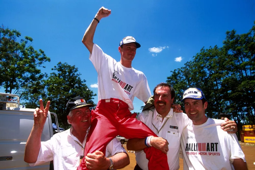 Richard Burns, Mitsubishi and co-driver Robert Reid,  celebrate their debut with with the Mitsubishi Ralliart team