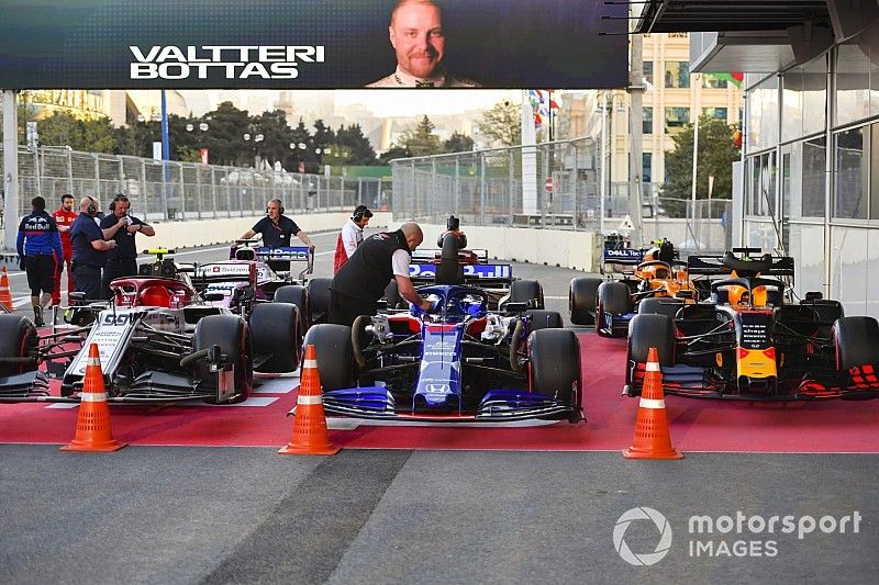 The cars of Antonio Giovinazzi, Alfa Romeo Racing C38, Daniil Kvyat, Toro Rosso STR14, Max Verstappen, Red Bull Racing RB15, Sergio Perez, Racing Point RP19, Kimi Raikkonen, Alfa Romeo Racing C38, and Lando Norris, McLaren MCL34, in Parc Ferme after Qualifying