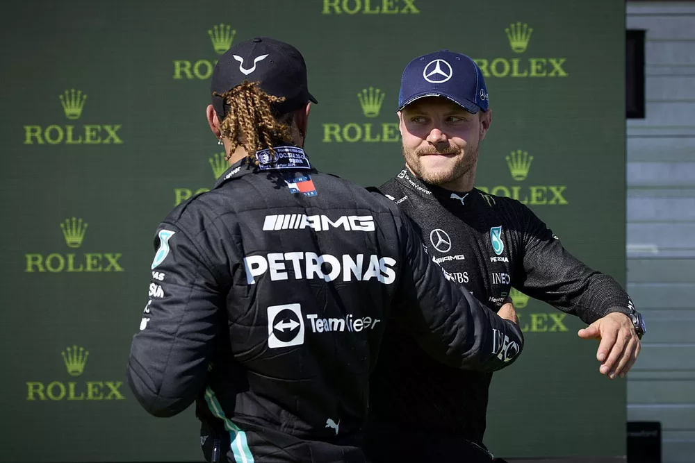 Lewis Hamilton, Mercedes, and Valtteri Bottas, Mercedes, congratulate each other after locking out the front row