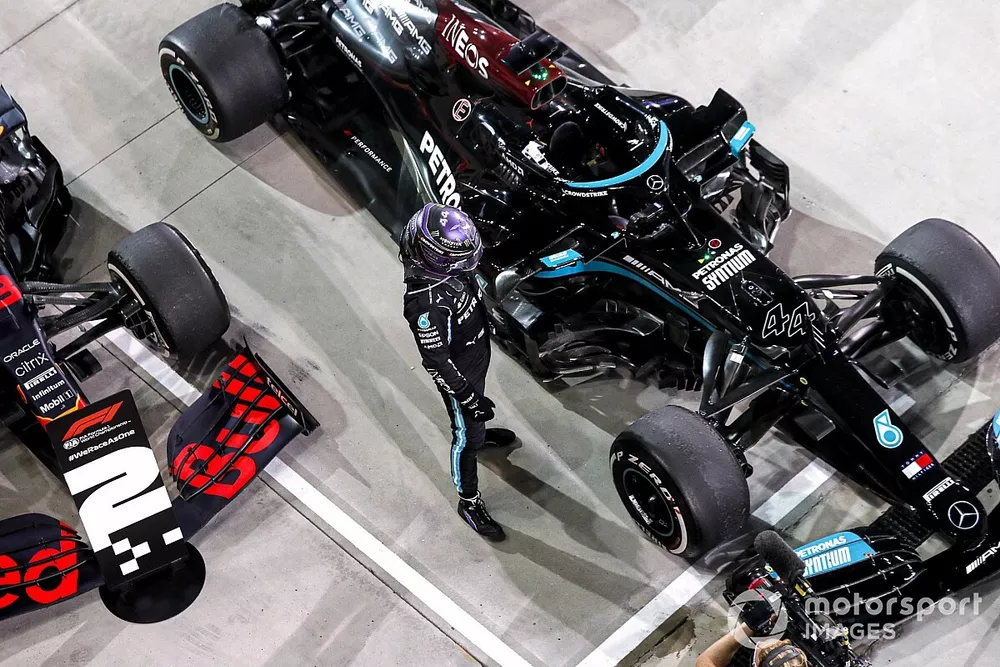 Race Winner looking at his car in Parc Ferme 