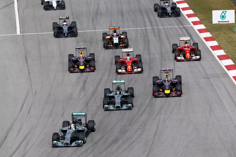 Lewis Hamilton, Mercedes W05, leads Nico Rosberg, Mercedes W05, Sebastian Vettel, Red Bull Racing RB10 Renault, Fernando Alonso, Ferrari F14T, Daniel Ricciardo, Red Bull Racing RB10 Renault, Kimi Raikkonen, Ferrari F14T, Nico Hulkenberg, Force India VJM07 Mercedes, and Kevin Magnussen, McLaren MP4-29 Mercedes, at the start