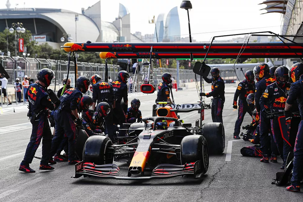 Sergio Perez, Red Bull Racing RB16B, makes a pit stop