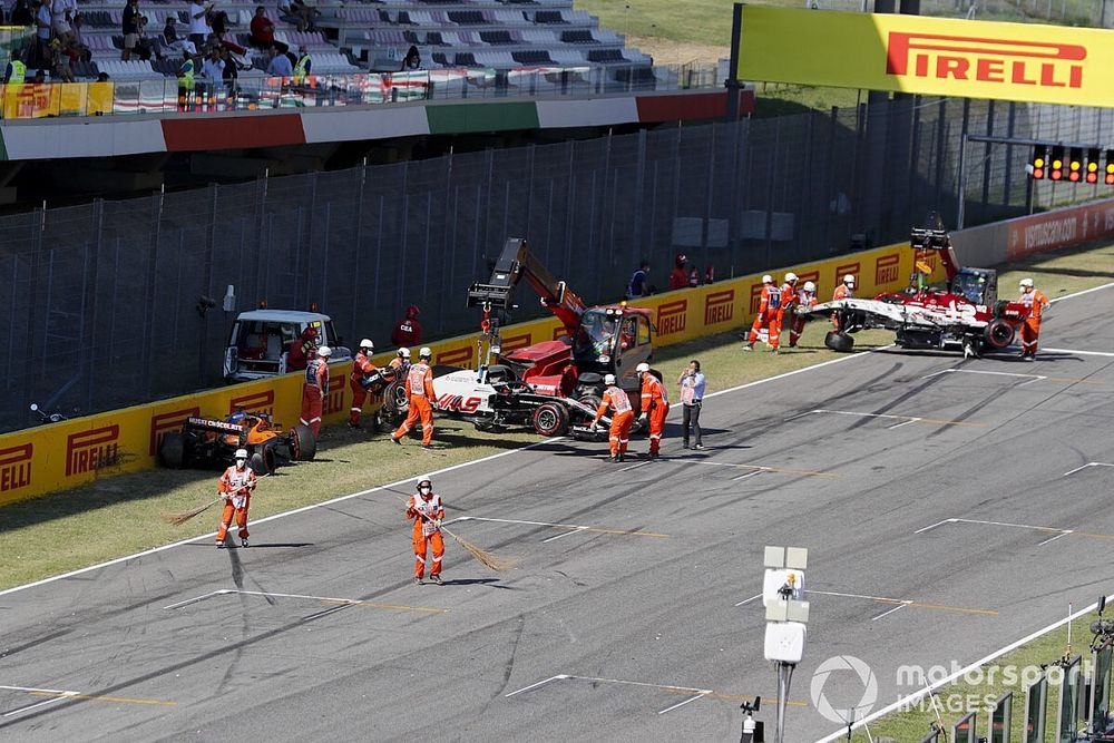 Cars of Carlos Sainz Jr., McLaren MCL35, Kevin Magnussen, Haas VF-20 and Antonio Giovinazzi, Alfa Romeo Racing C39 being recovered after crashing