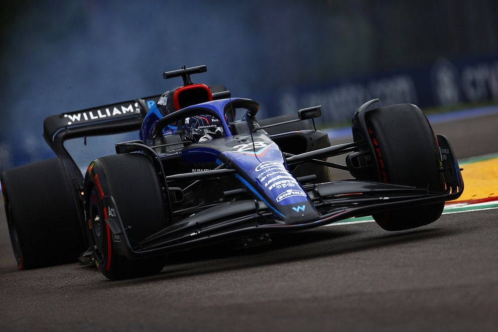 Alex Albon, Williams FW44, with a fire at the rear