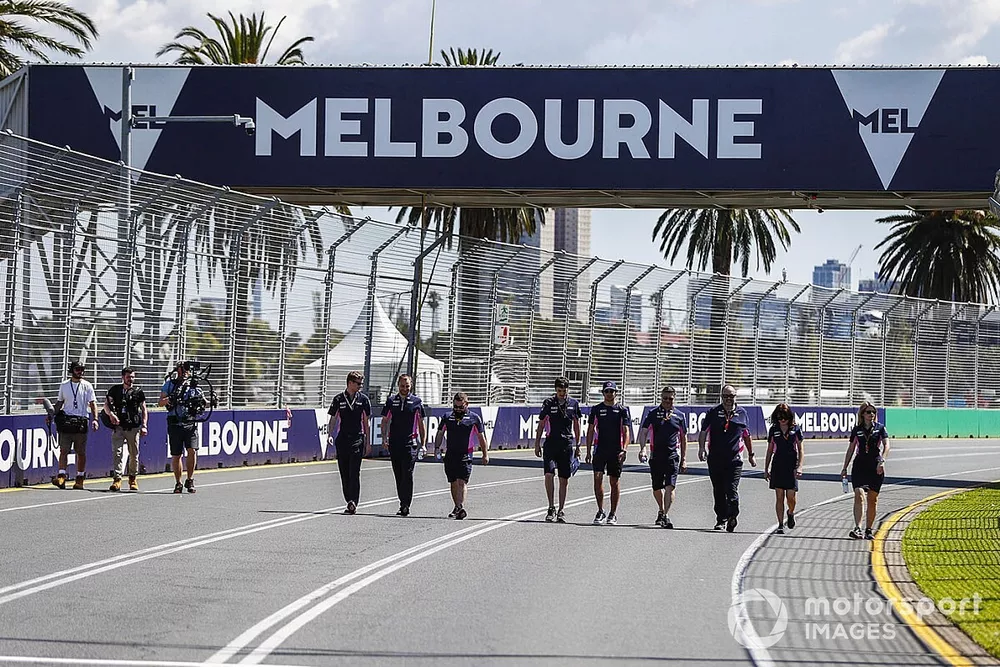 Lance Stroll, Racing Point walks the track with members of the team