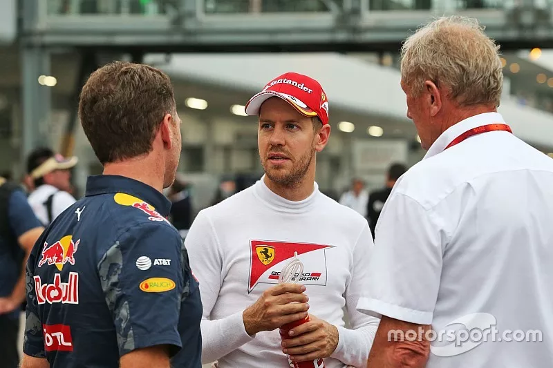 (L to R): Christian Horner, Red Bull Racing Team Principal with Sebastian Vettel, Ferrari and Dr Hel