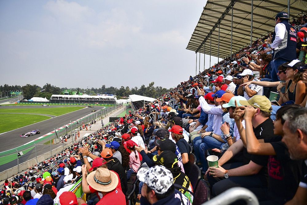 Fans cheer as Sergio Perez, Racing Point RP19, passes
