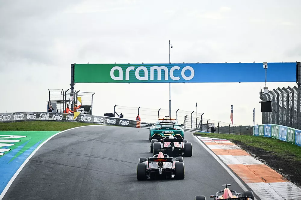 The Aston Martin Vantage Safety Car leads the field