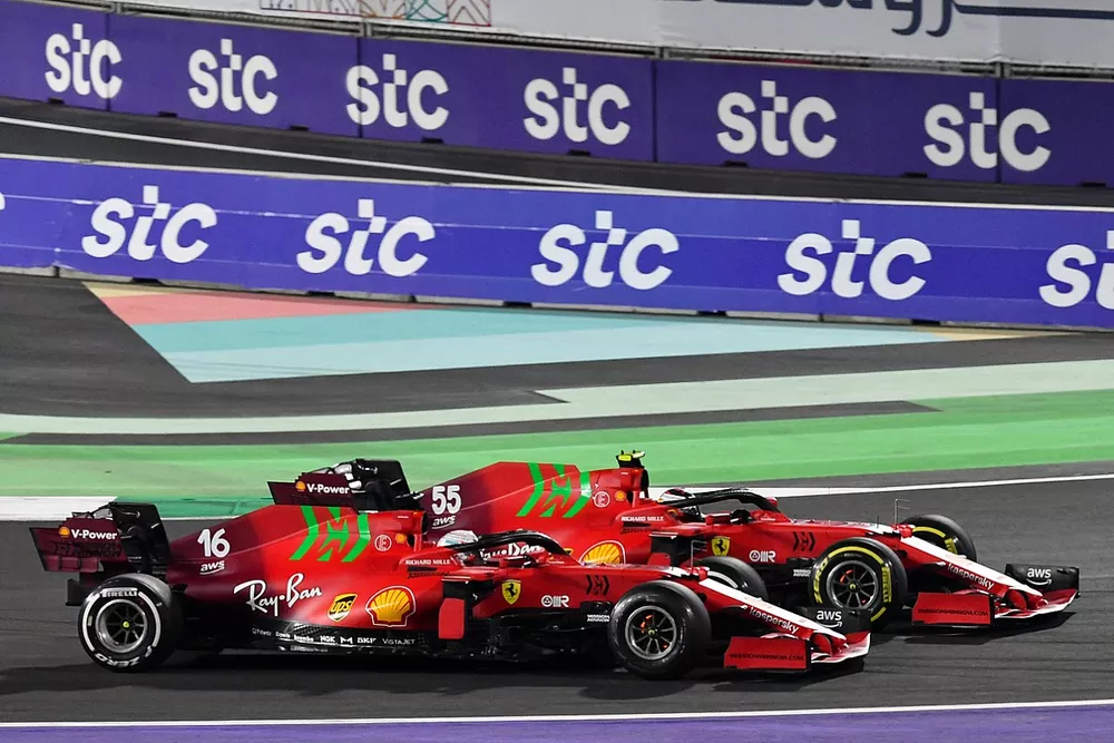 Charles Leclerc, Ferrari SF21, battles with Carlos Sainz Jr., Ferrari SF21
