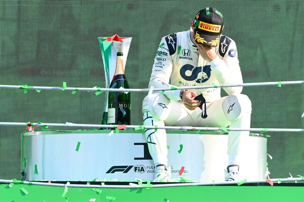 Pierre Gasly, AlphaTauri, 1st position, sits down on the podium to contemplate his victory