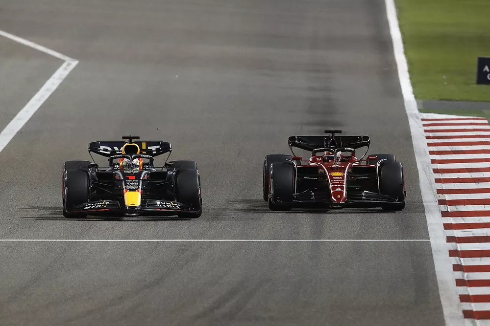 Max Verstappen, Red Bull Racing RB18, battles with Charles Leclerc, Ferrari F1-75