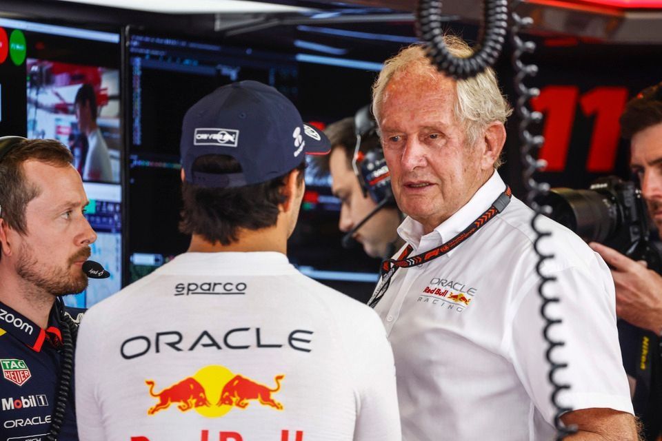 Sergio Perez, Red Bull Racing, speaks with Helmut Marko, Consultant, Red Bull Racing, in the garage