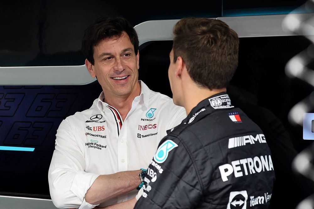 Toto Wolff, Team Principal and CEO, Mercedes AMG talks to George Russell, Mercedes-AMG in Mercedes garage