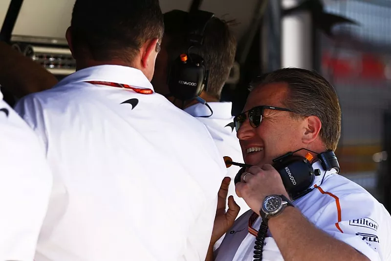 Eric Boullier, Racing Director, McLaren, talks with Zak Brown, Executive Director, McLaren Technology Group, on the McLaren pit wall