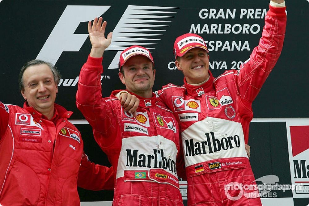 Podium: race winner Michael Schumacher with Rubens Barrichello and Paolo Martinelli