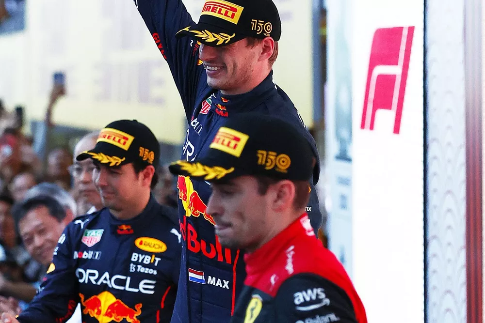 Sergio Perez, Red Bull Racing, 2nd position, Max Verstappen, Red Bull Racing, 1st position, Charles Leclerc, Ferrari, 3rd position, on the podium