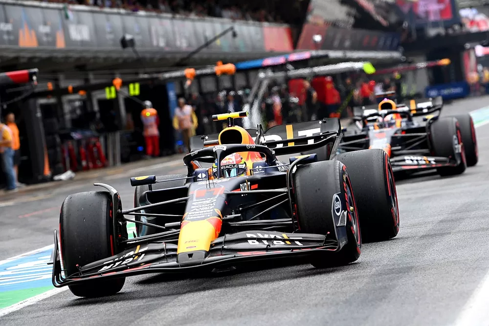 Sergio Perez, Red Bull Racing RB19, Max Verstappen, Red Bull Racing RB19, in the pit lane