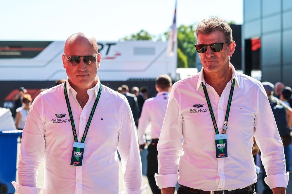 Cadillac F1 team CEO Dan Towriss walks in the paddock with Cadillac F1 Team Principal Graeme Lowdon.