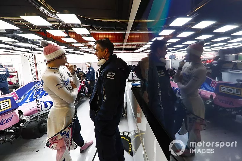 Lance Stroll, Racing Point, talks to Andy Stevenson, Sporting Director, Racing Point, in the team's garage