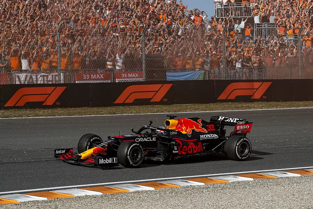 Max Verstappen, Red Bull Racing RB16B, 1st position, waves to fans on his way to Parc Ferme
