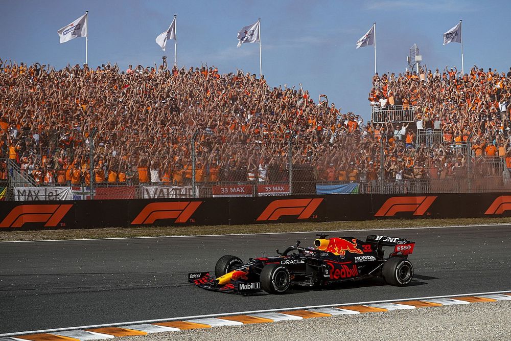 Max Verstappen, Red Bull Racing RB16B, 1st position, waves to fans on his way to Parc Ferme