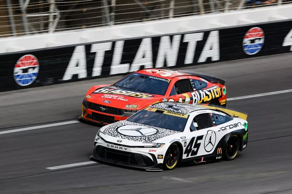 Tyler Reddick, 23XI Racing, Jordan Brand Toyota Camry Michael McDowell, Front Row Motorsports, B'laster Work It Like A Pro Ford Mustang