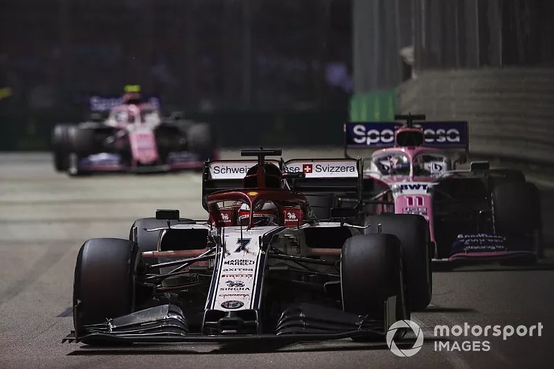 Kimi Raikkonen, Alfa Romeo Racing C38, leads Sergio Perez, Racing Point RP19, and Lance Stroll, Racing Point RP19
