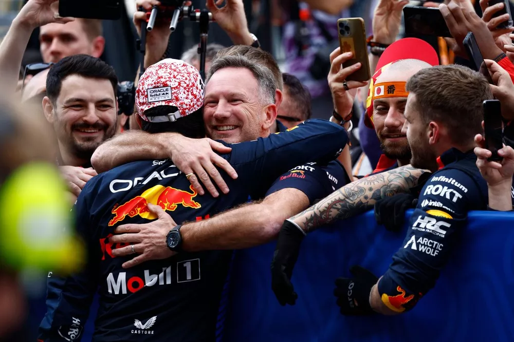 Sergio Perez, Red Bull Racing, 2nd position, embraces Christian Horner, Team Principal, Red Bull Racing in celebration in Parc Ferme 