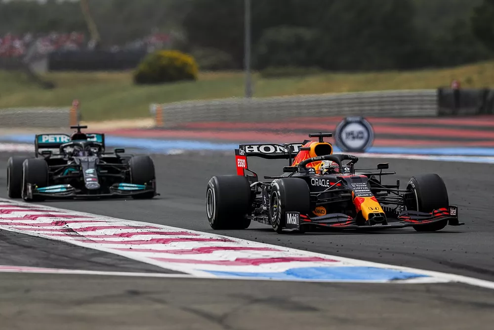 Max Verstappen, Red Bull Racing RB16B, leads Sir Lewis Hamilton, Mercedes W12
