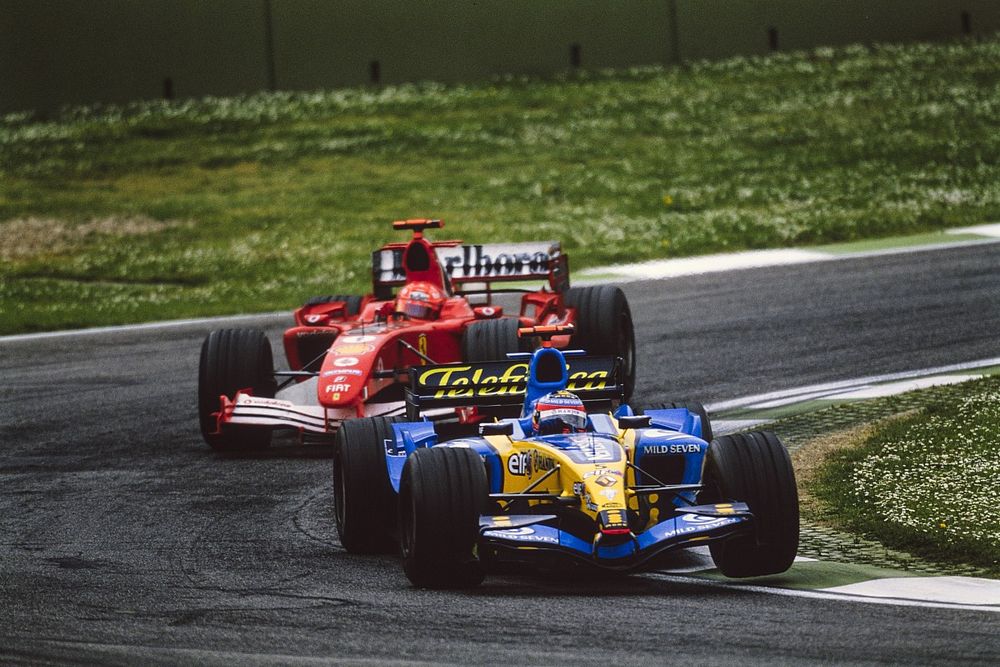 Fernando Alonso, Renault R25, leads Michael Schumacher, Ferrari F2005